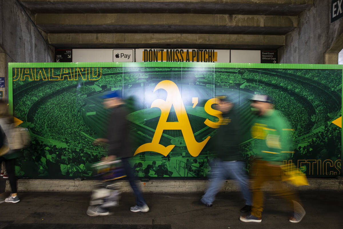 Oakland Athletics fans walk the concourse before the opening night game against the Baltimore O ...