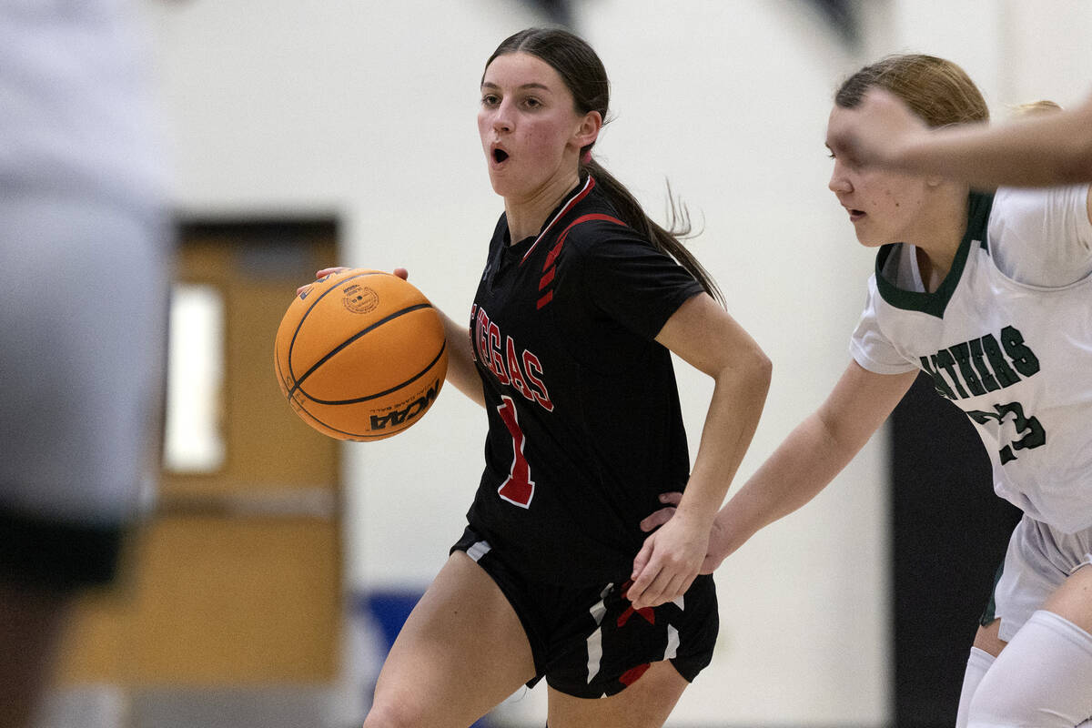 Las Vegas’ Layla Faught (1) drives around Palo Verde’s Breanna Scholz (23) during ...