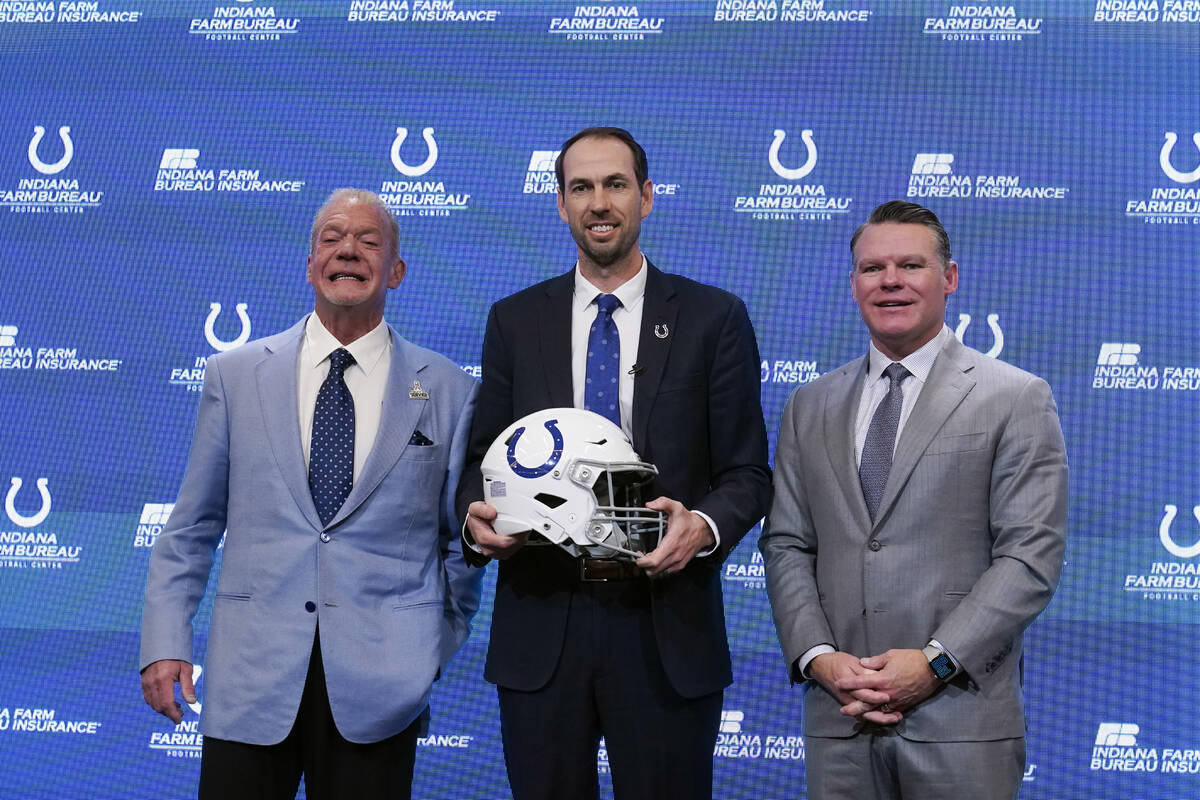 Shane Steichen, middle, Indianapolis Colts owner Jim Irsay, left, and Colts general manager Chr ...