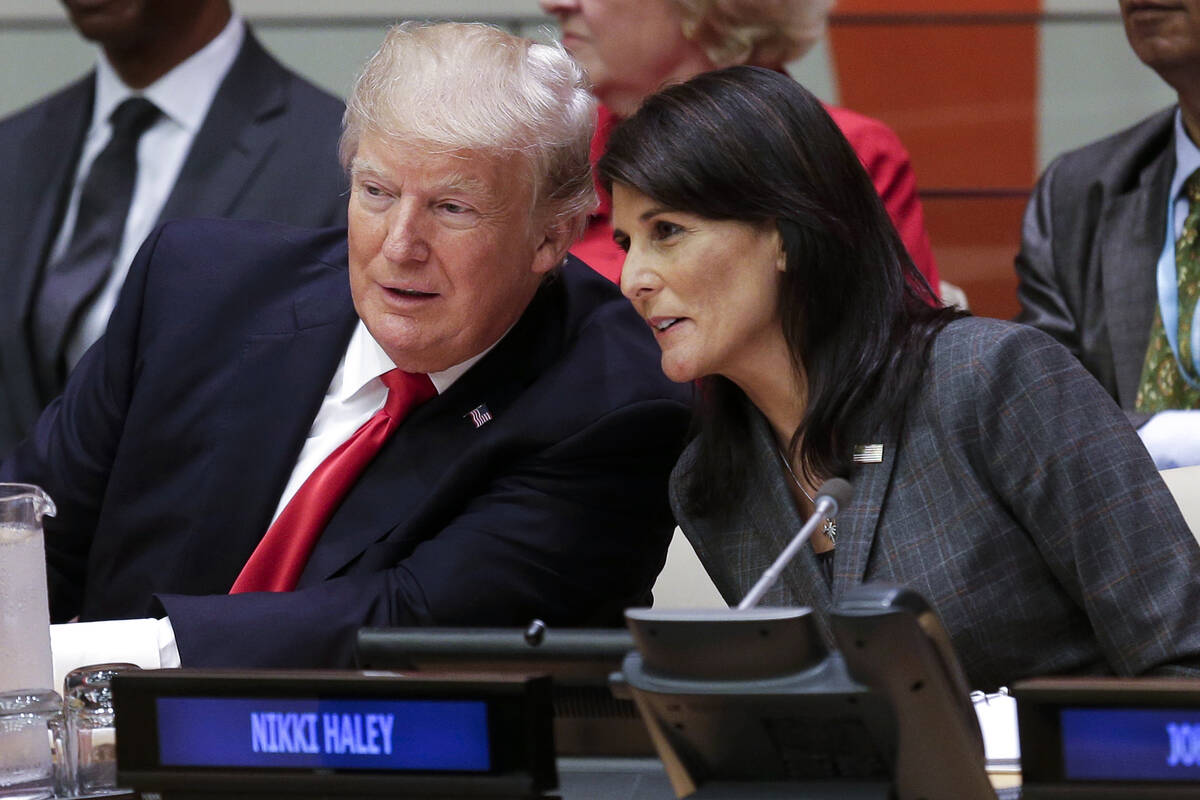 FILE - President Donald Trump speaks with U.S. Ambassador to the United Nations Nikki Haley bef ...