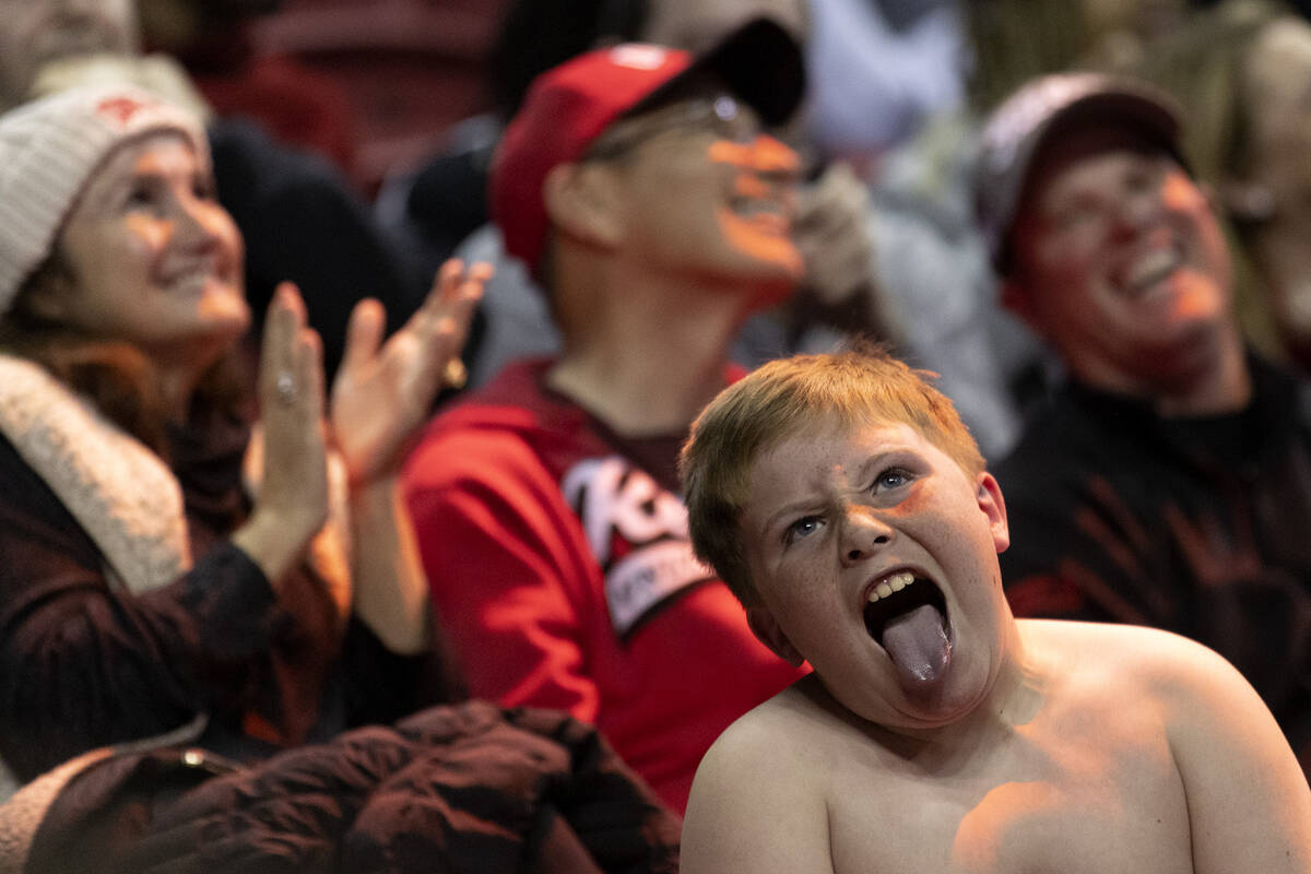 A young UNLV Rebels fan puts a show on for the cameras during the second half of an NCAA colleg ...