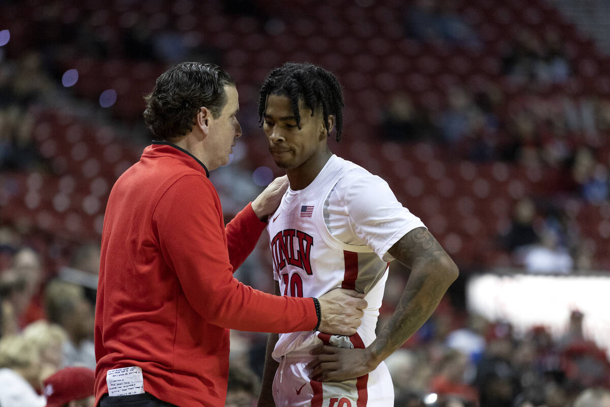 UNLV Rebels assistant coach Barret Peery talks with Rebels guard Keshon Gilbert (10) on the sid ...