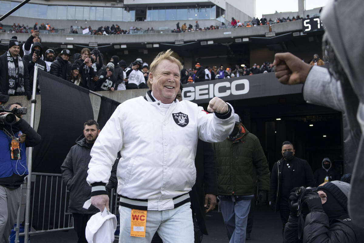 Raiders owner Mark Davis makes his way to the field before an NFL playoff game between the Raid ...