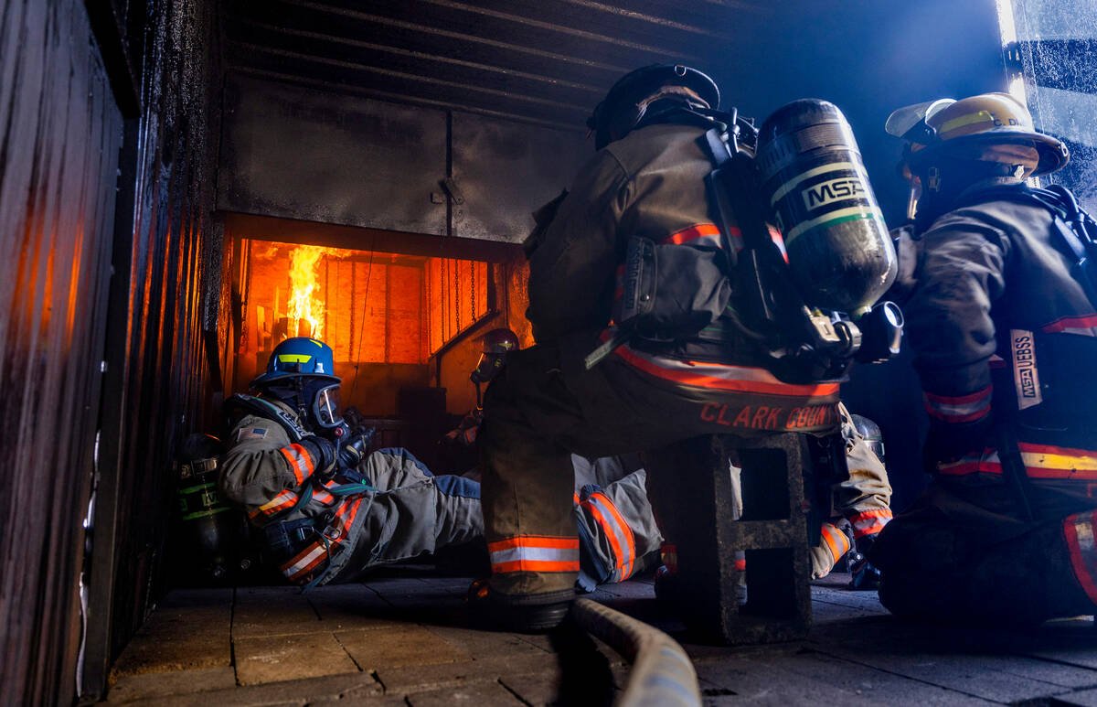 Clark County Fire Department recruits take positions within a trailer which will be overtaken w ...