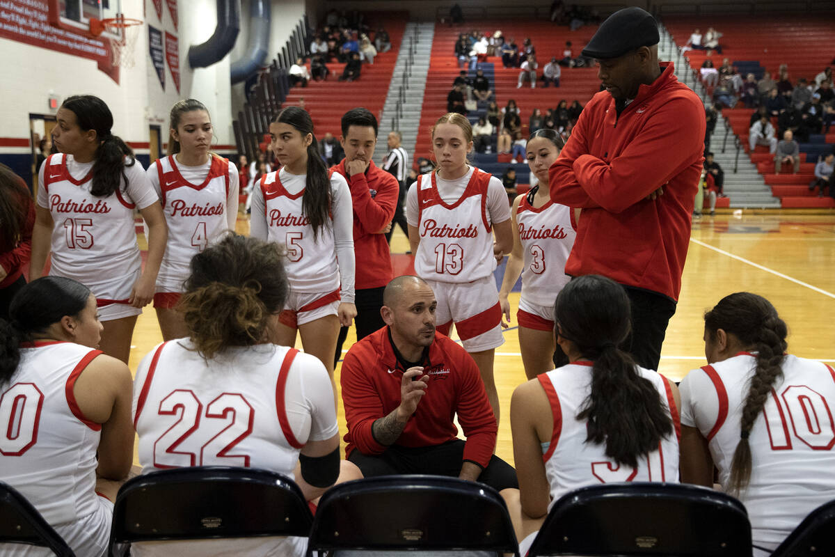 Liberty’s head coach Billy Hemberger instructs his team in a timeout during a Class 5A S ...