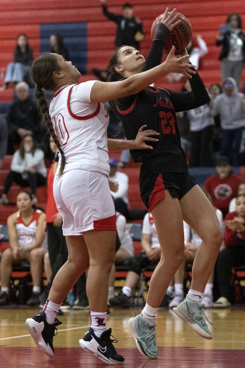 Coronado’s Gabrielle De La Cruz (23) shoots against Liberty’s Alofa Eteuini (10) ...