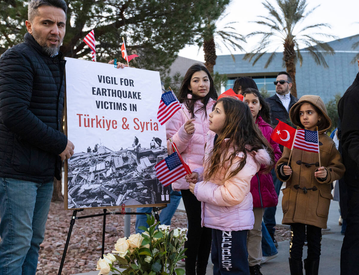Members of the Turkish community, including Ozgur Ozdemir, left, and his daughter Ada , 8, fron ...