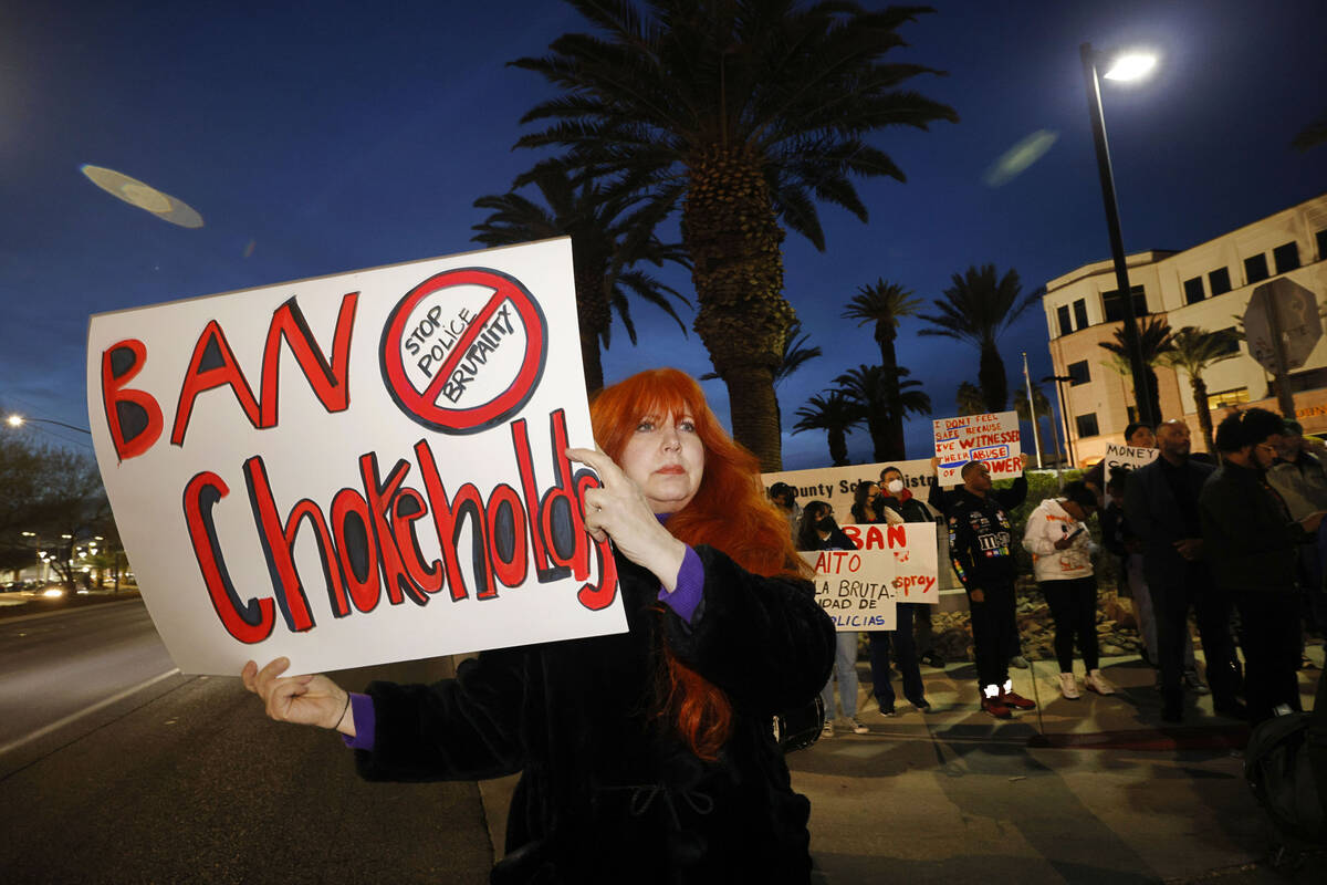 Protesters including Pam Jahan-Shahi of Henderson hold signs outside the Clark County School Di ...