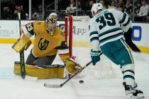 San Jose Sharks center Logan Couture (39) skates by Vegas Golden Knights goaltender Adin Hill ( ...