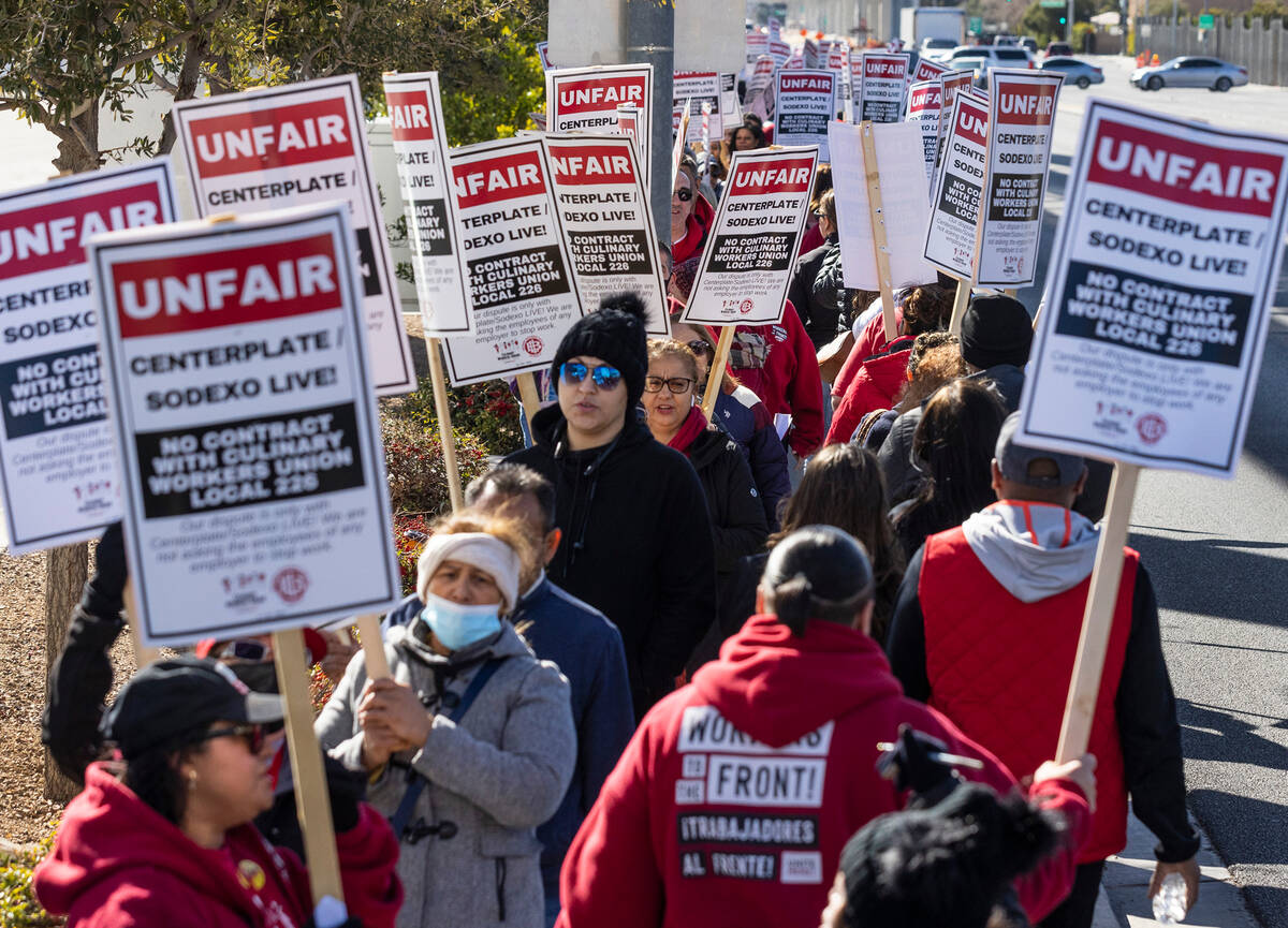 Culinary union workers picket in front of the Las Vegas Convention Center on Thursday, Feb. 16, ...