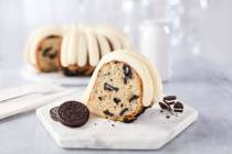 The Oreo Cookies & Cream Bundt Cake at Nothing Bundt Cakes is made with white cake baked with O ...