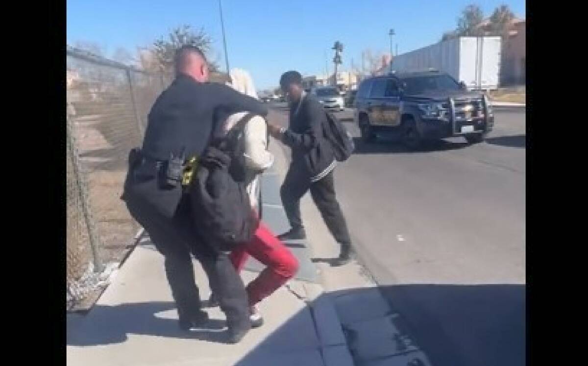 A screenshot of a video showing an incident between a CCSD police officer and someone who appea ...