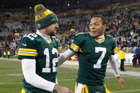 Green Bay Packers' Brett Hundley talks to Aaron Rodgers an NFL football game against the Seattl ...