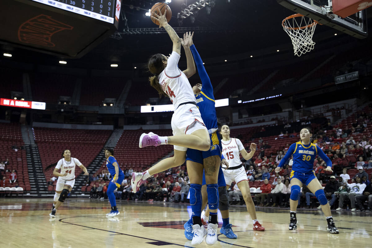 UNLV Lady Rebels guard Essence Booker (24) shoots against San José State Spartans guard Ja ...