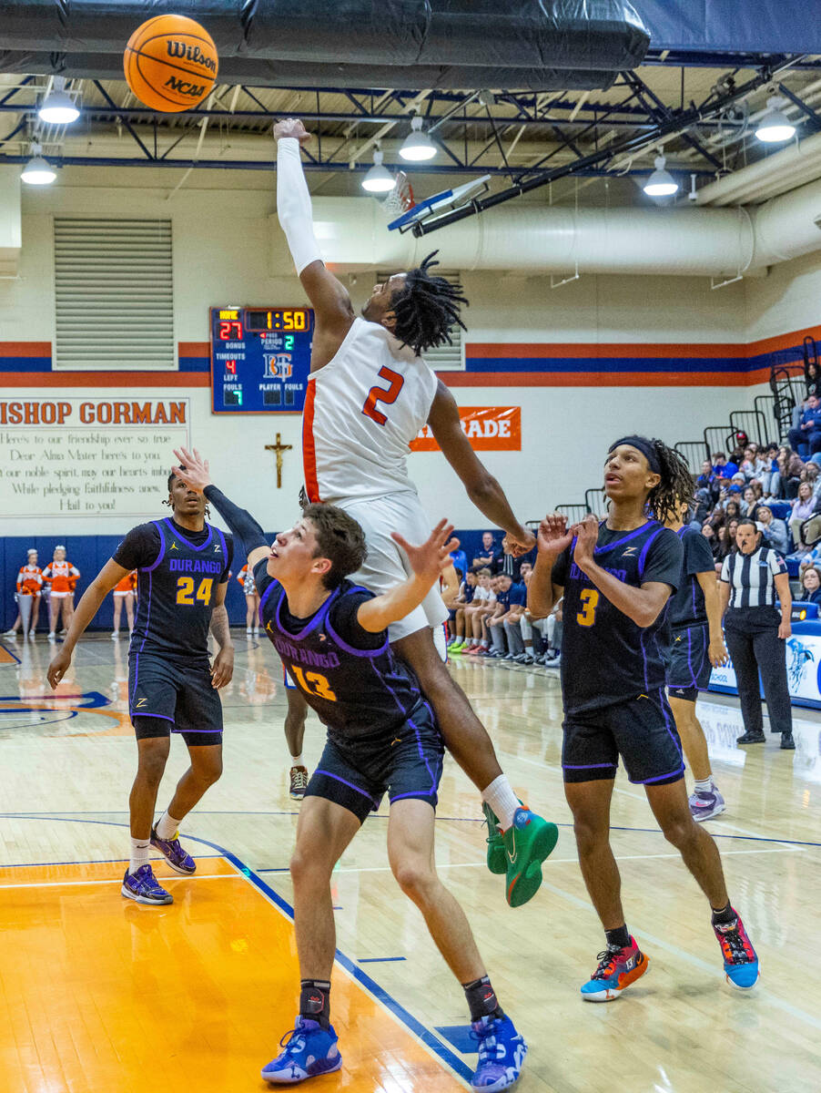 Bishop Gorman's Keenan Bey (2) goes over the top of Durango's Colton Kroll (13) during the firs ...