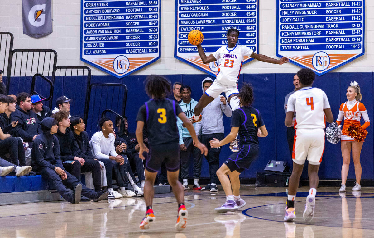 Bishop Gorman's Chris Nwuli (23) elevates for a pass over Durango's Mason Brown (2) during the ...