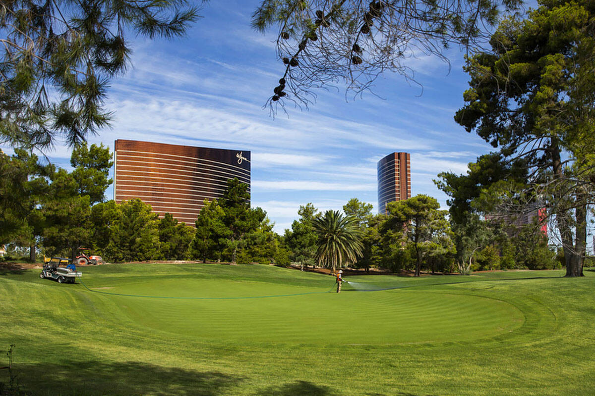 Maintenance crew water the 14th green at Wynn Golf Club in 2019 in Las Vegas. (L.E. Baskow/Las ...