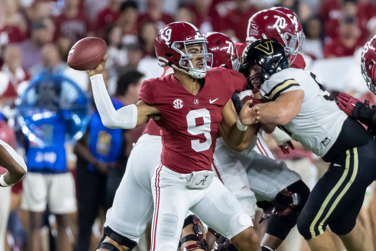 Alabama quarterback Bryce Young (9) throws a pass during the first half of the team's NCAA coll ...
