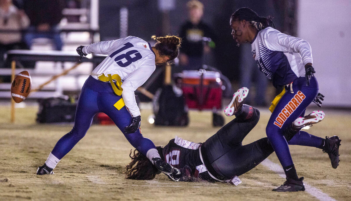 Desert Oasis' Makena Siaki (18) is taken down hard on a long pass attempt by Legacy's Mara Hodg ...