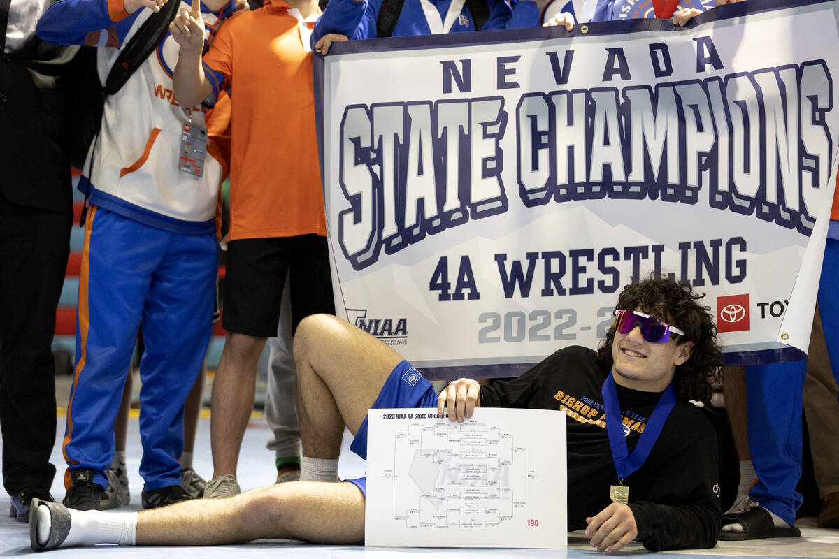 Bishop Gorman’s Kage Mir takes center stage while posing for photos with his team after ...