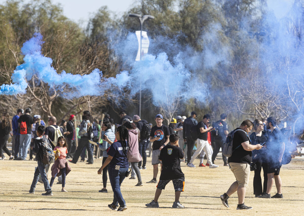 Participants at Pokémon Go Tour: Hoenn – Las Vegas navigate Sunset Park while play ...