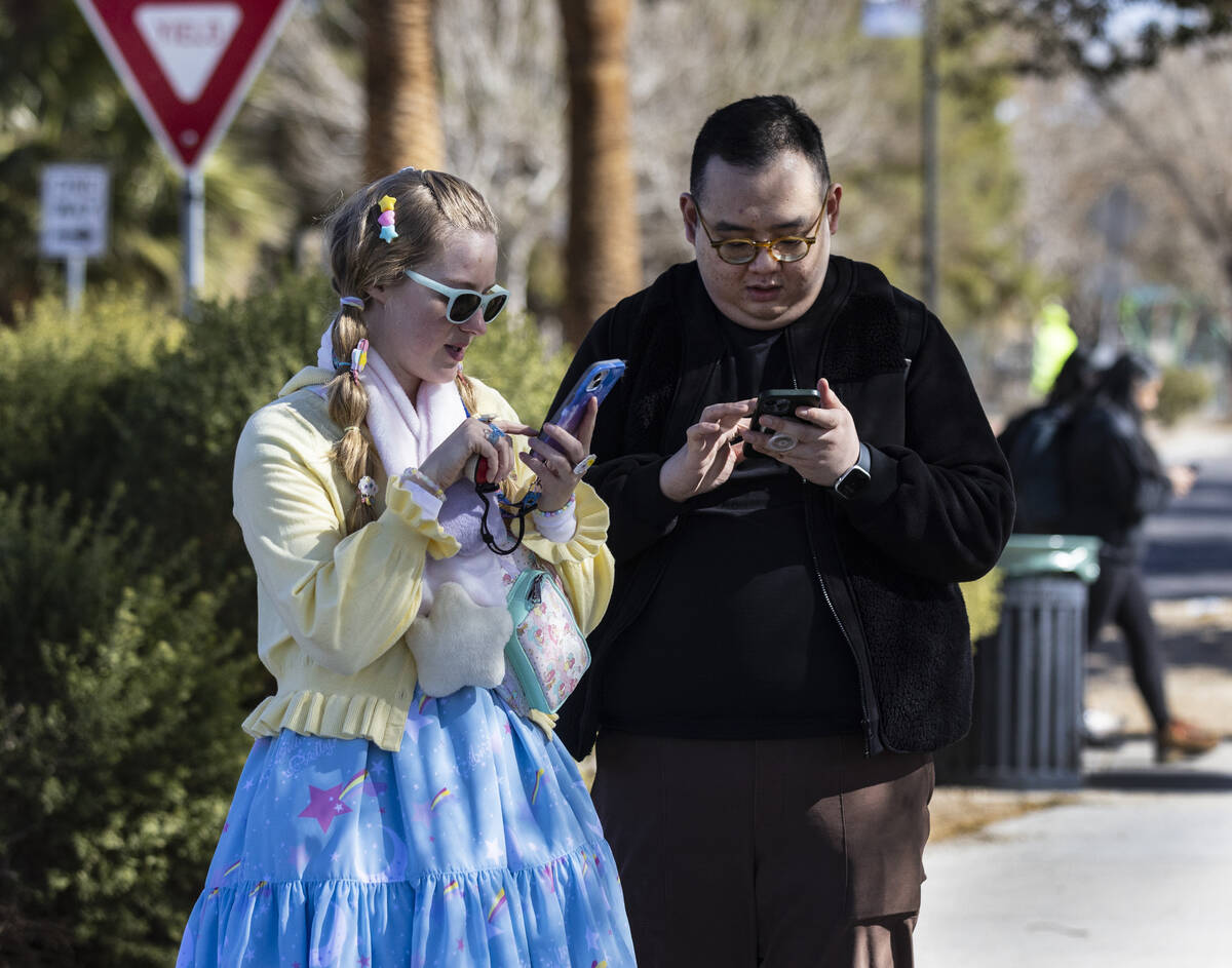 Mindy Pile, left, and her friend Edgar navigate Sunset Park while playing Pokémon Go, on S ...