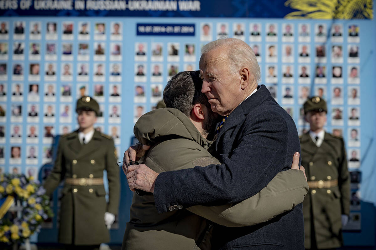 President Joe Biden, right, and Ukrainian President Volodymyr Zelenskyy hug as they say goodbye ...