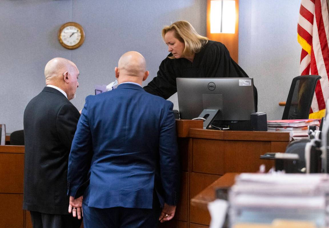 Defense attorney Dominic Gentile, left, representing Adolfo Orozco, owner of the Alpine Apartme ...