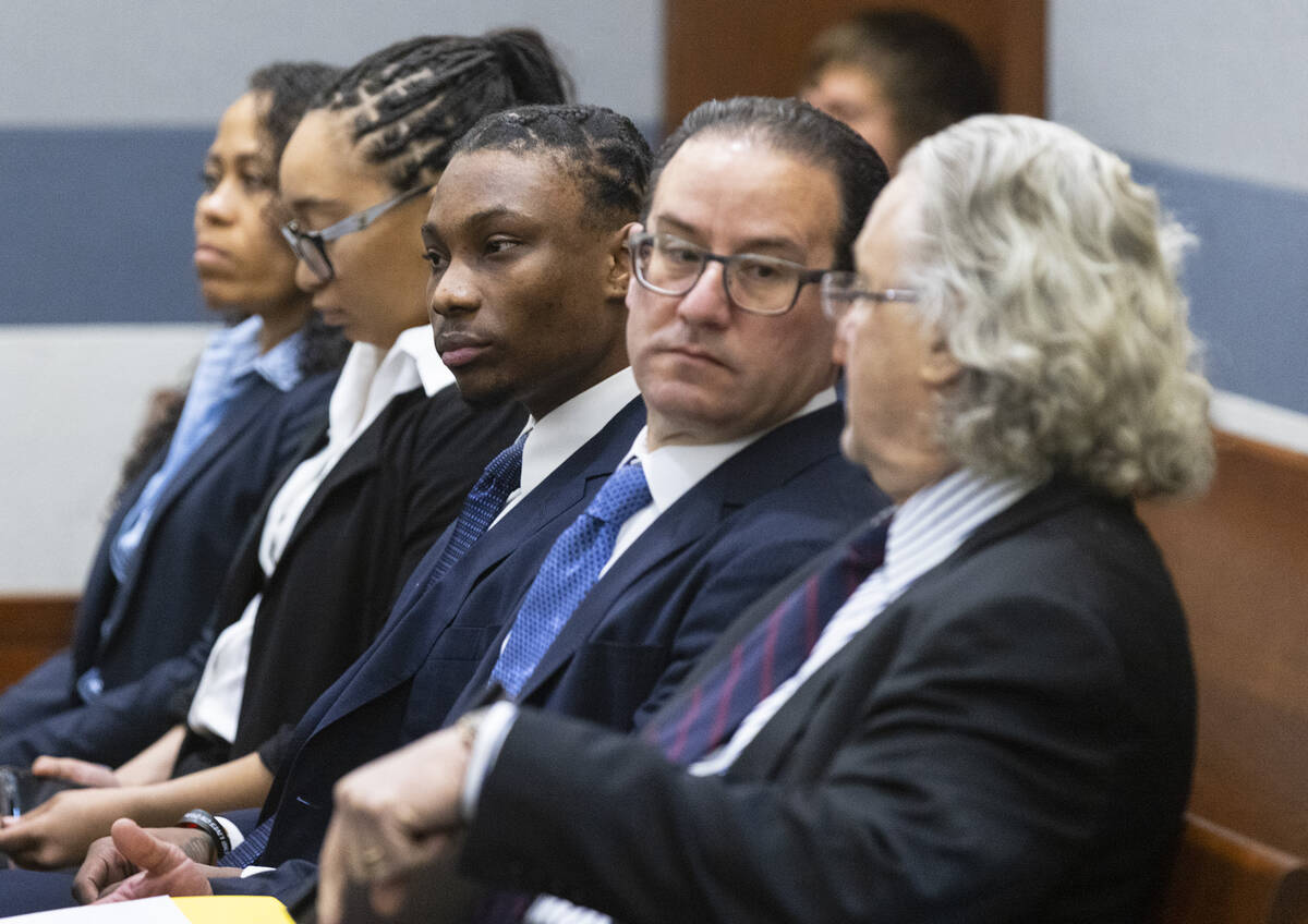 Ex-Raiders wide receiver Henry Ruggs, center, appears in court with his attorneys David Chesnof ...