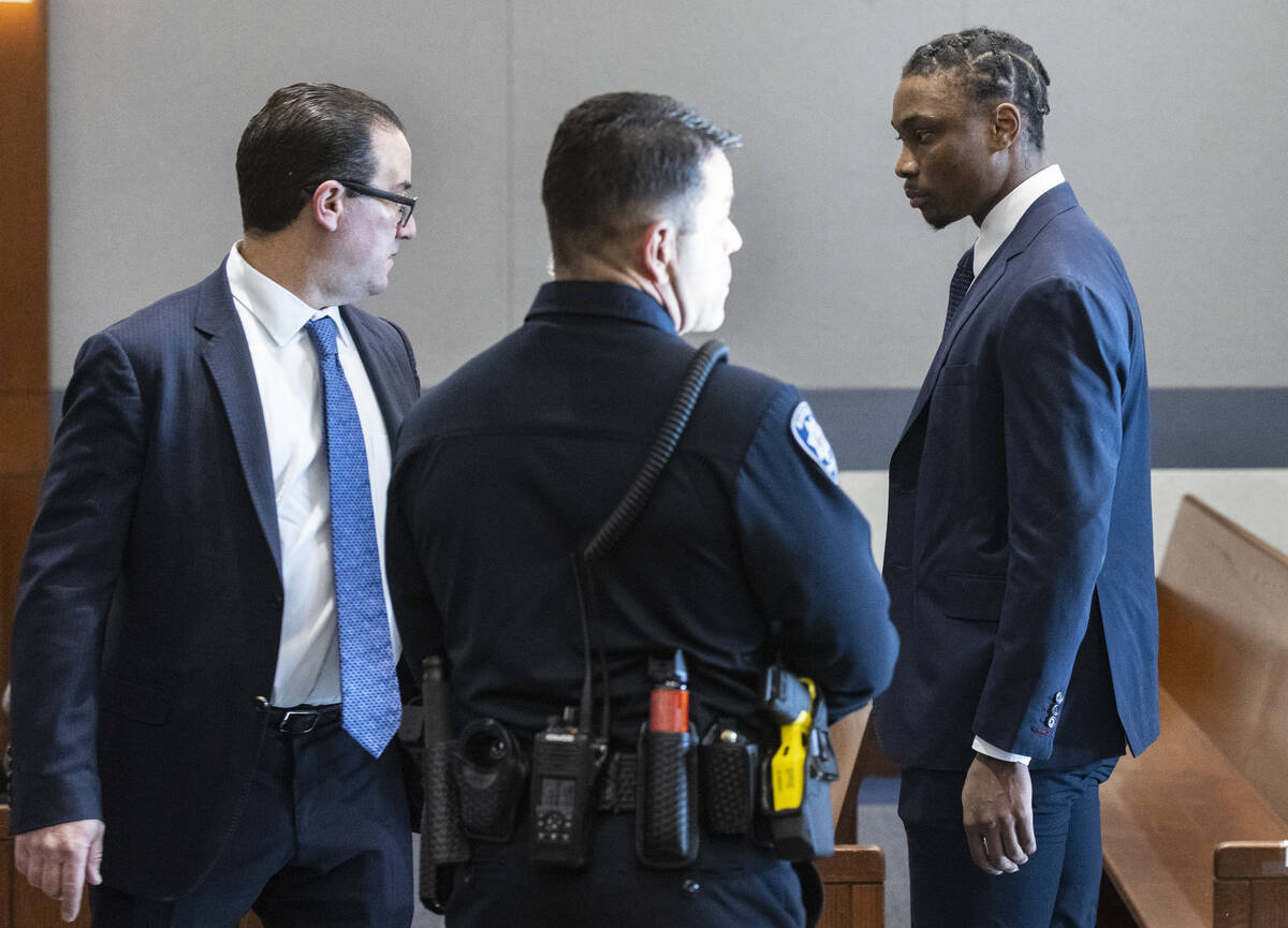 Ex-Raiders wide receiver Henry Ruggs, right, and his attorney Richard Schonfeld enter the court ...