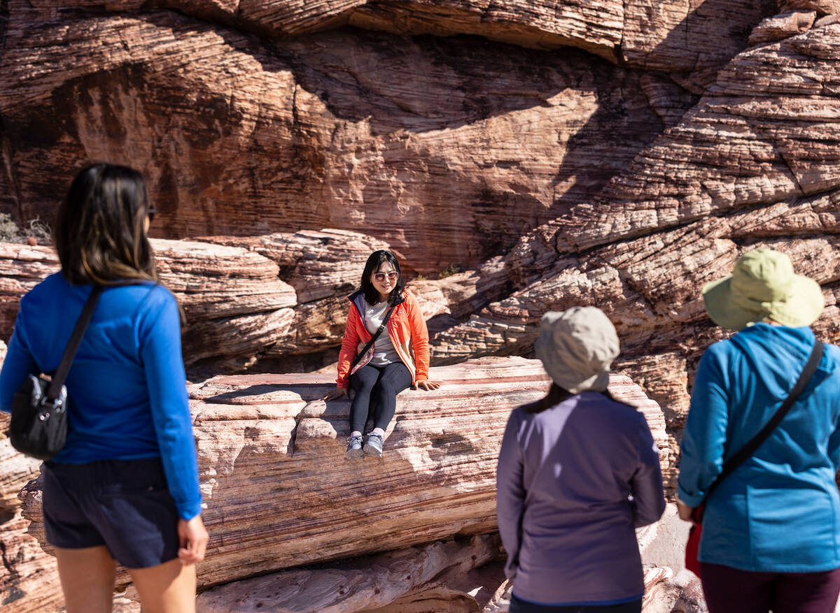 Bo Kwon, center, of South Korea, poses for a photo as she visits the Red Rock Canyon National C ...