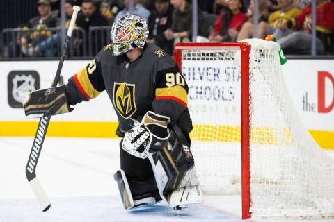 Golden Knights goaltender Robin Lehner (90) kneels by the net during a break in the second peri ...
