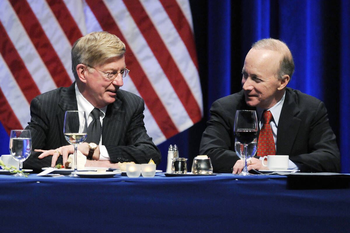 Commentator George Will (L) talks with Mitch Daniels, Governor of Indiana, at the Conservative ...