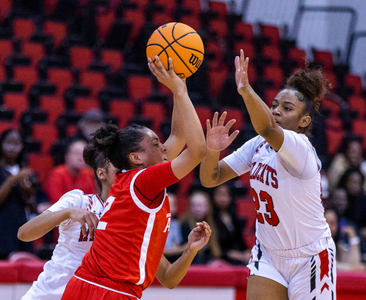 Arbor View's Aliyah Gantz (2) attempts to pass against Las Vegas' Kayla Terry (23) during the f ...