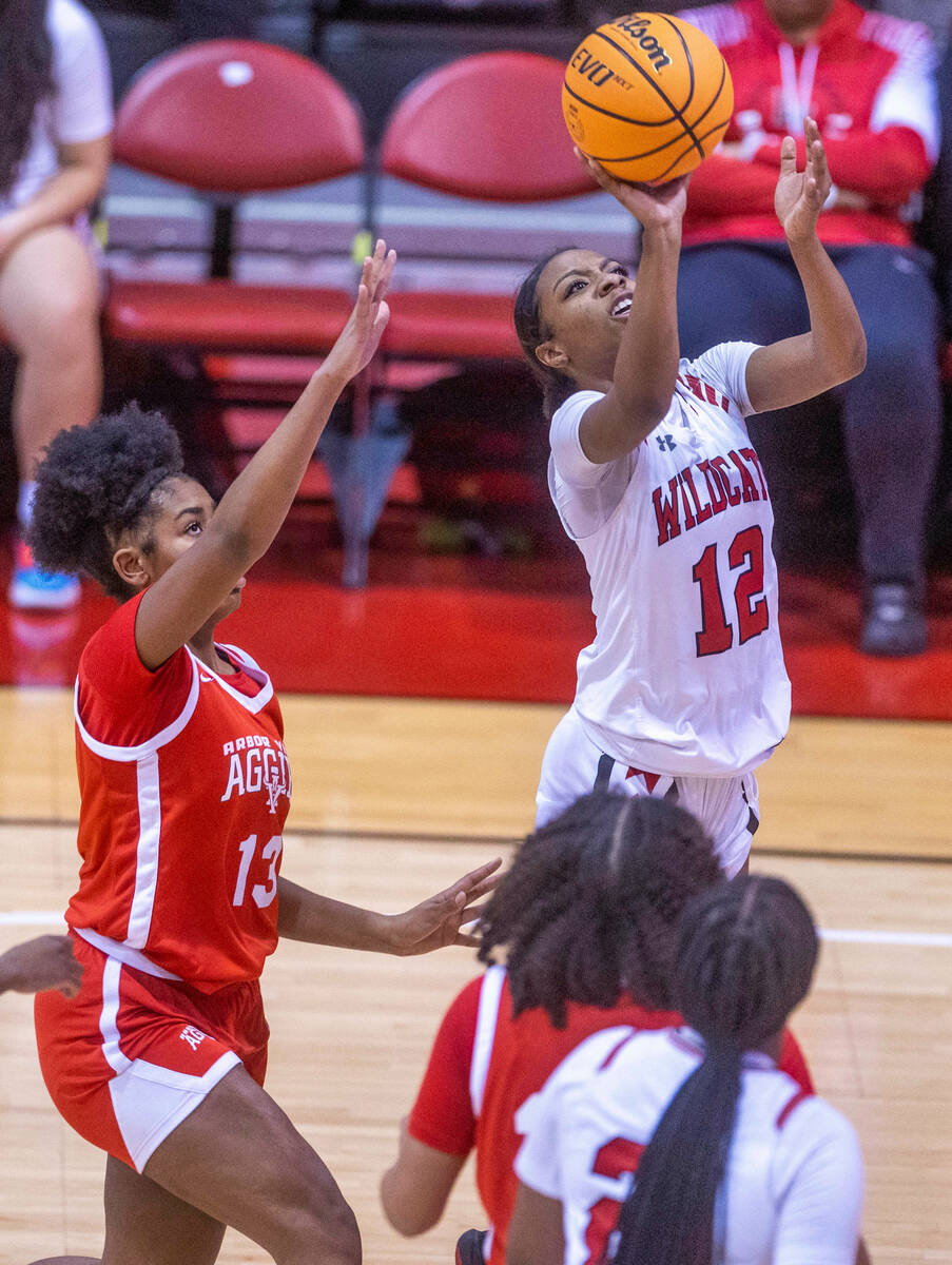 Las Vegas' Jaidyn Savoy (12) shoots over Arbor View's Talyiah Mckinney (13) during the second h ...