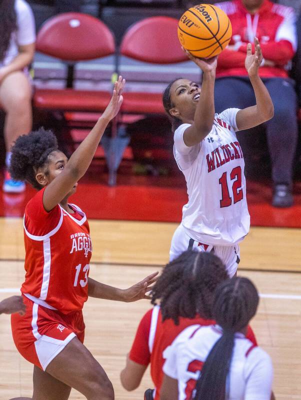 Las Vegas' Jaidyn Savoy (12) shoots over Arbor View's Talyiah Mckinney (13) during the second h ...