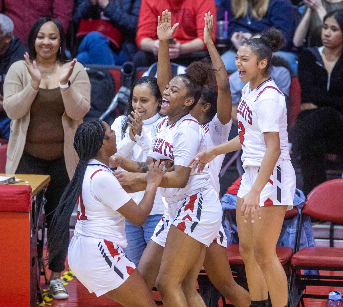 Las Vegas players celebrate their win over Arbor View following the second half of their Class ...