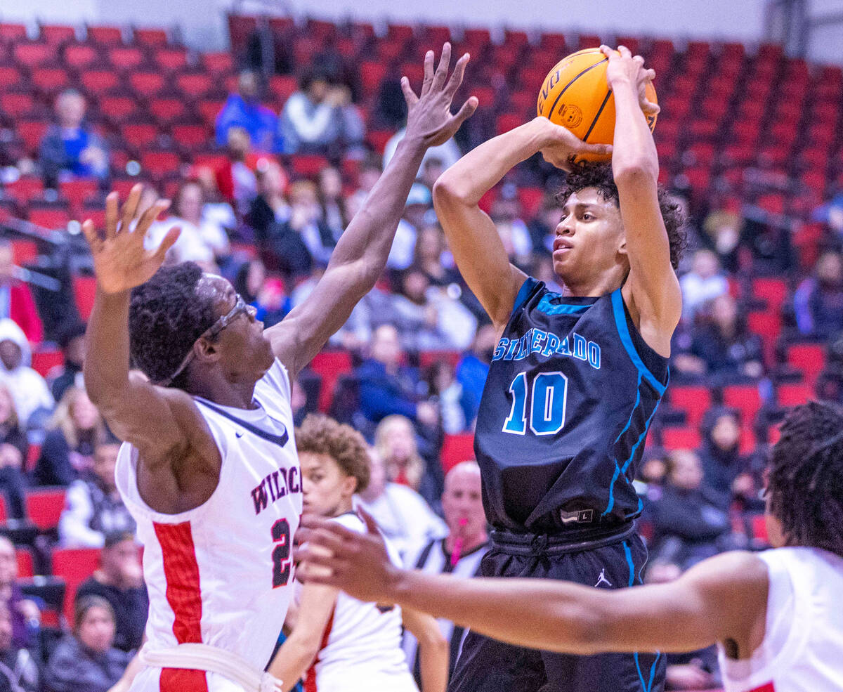 Silverado's Cyril Franklin, Jr. (10) looks to shoot over Las Vegas' Jordan Stevens (24) during ...