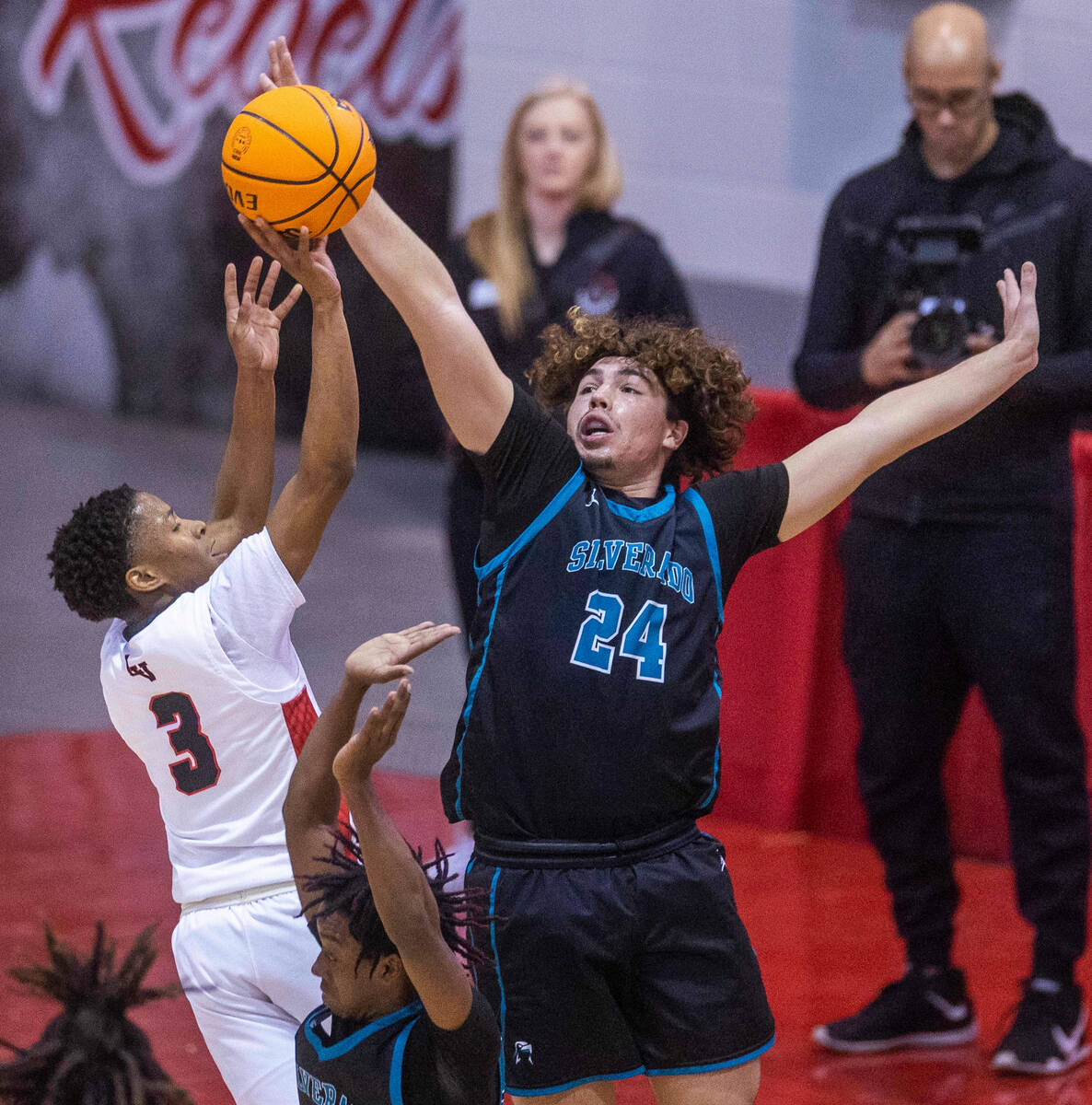 Las Vegas' Tayshaun Jackson (3) gets off an elevated shot as Silverado's Mike Andersen (24) att ...