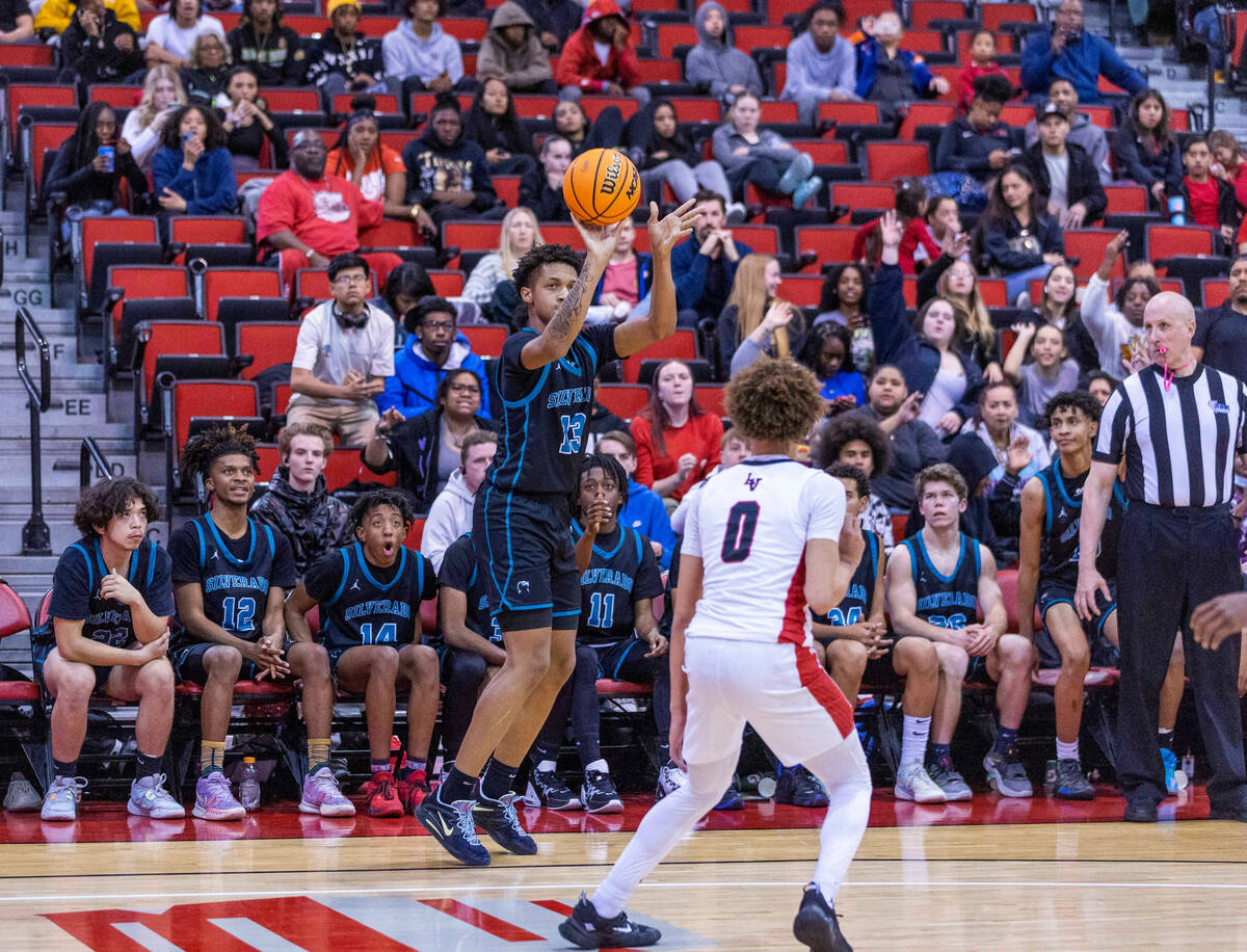 Silverado's Travis Fralin (13) sets up a critical 3-point basket over Las Vegas' Jordan Massey ...