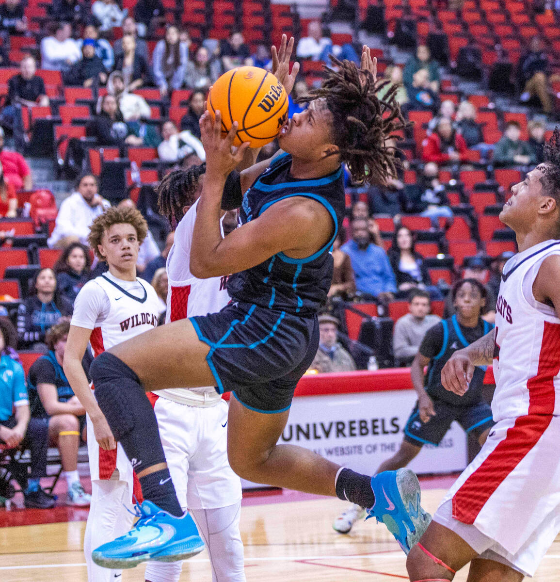 Silverado's Julius Robinson (3) elevates to get a shot off over Las Vegas' Bryce Davis (14) dur ...