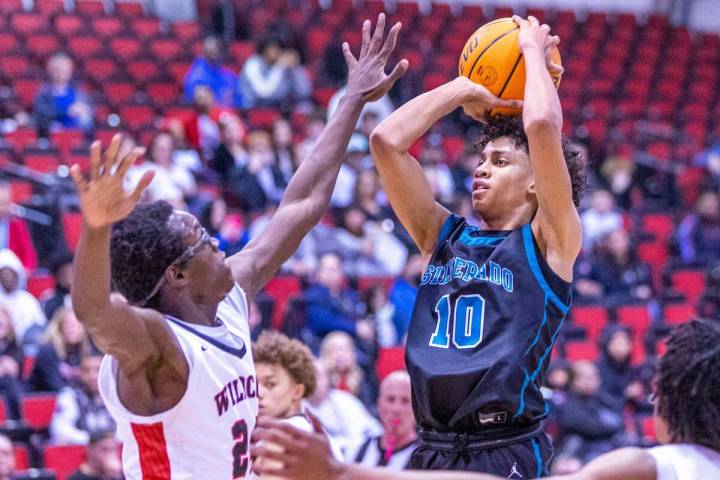 Silverado's Cyril Franklin, Jr. (10) looks to shoot over Las Vegas' Jordan Stevens (24) during ...