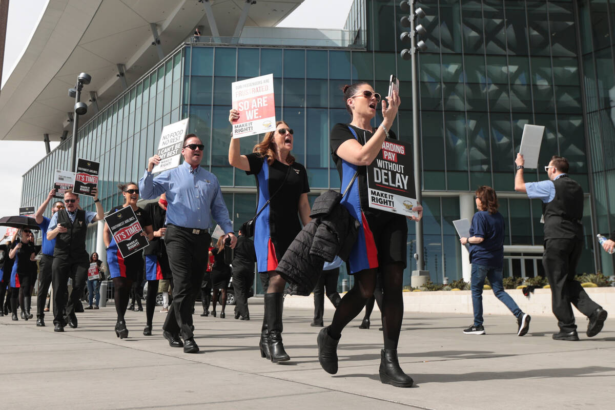 Members of Transport Workers Union Local 556, the union of Southwest Airlines flight attendants ...