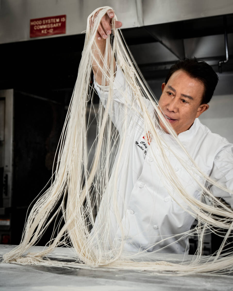Chef Martin Yan demonstrates the art of noodle pulling in the kitchen of M.Y. Asia, his new res ...