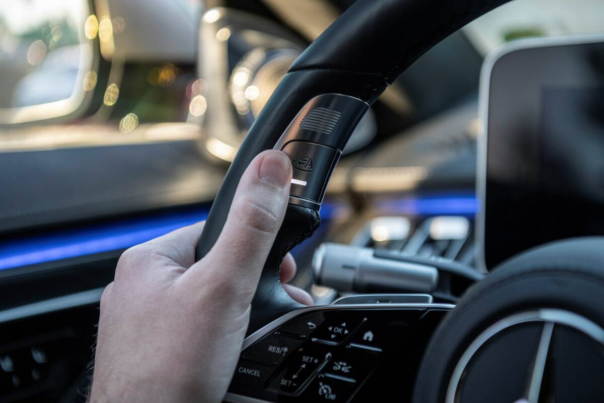 The control button for the Mercedes-Benz Drive Pilot technology is located on the steering whee ...