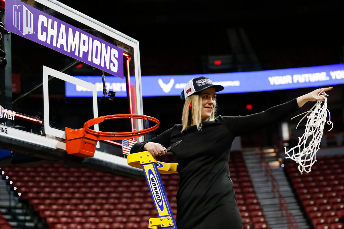 UNLV Lady Rebels head coach Lindy La Rocque reacts after cutting down the net after defeating t ...