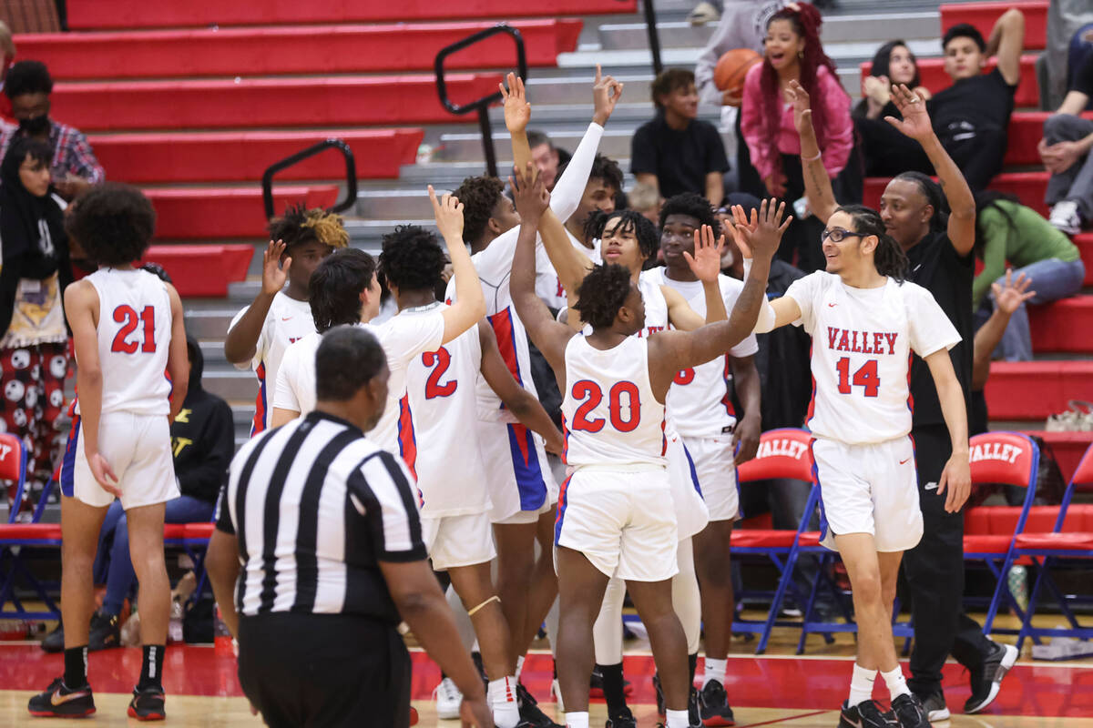 Valley players celebrate after defeating Legacy in a basketball game at Valley High School on T ...