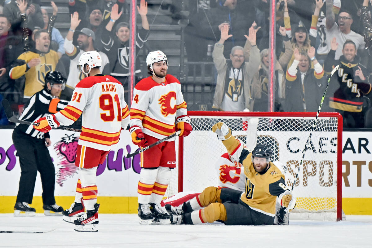 Vegas Golden Knights right wing Phil Kessel (8) celebrates a goal by teammate William Carrier ( ...