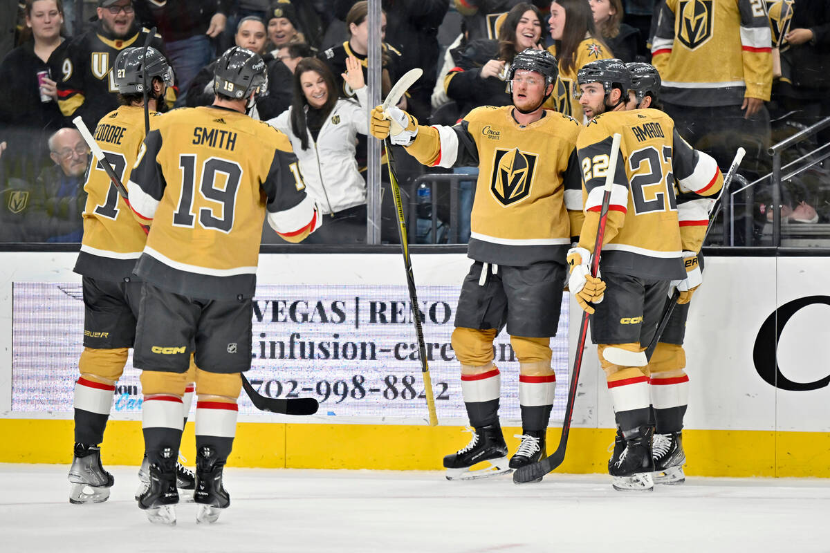 Vegas Golden Knights center Jack Eichel (9) celebrates with teammates after scoring against the ...