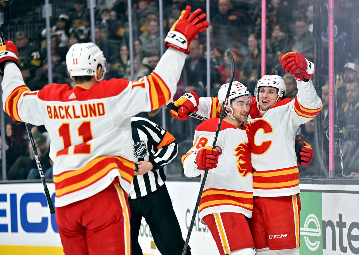 Calgary Flames center Mikael Backlund (11), left wing Andrew Mangiapane (88) and left wing Jako ...